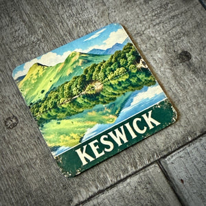 Keswick metal fridge magnet featuring vintage-style Catbells artwork, showing the attached magnet on the reverse and 60 × 60mm size.