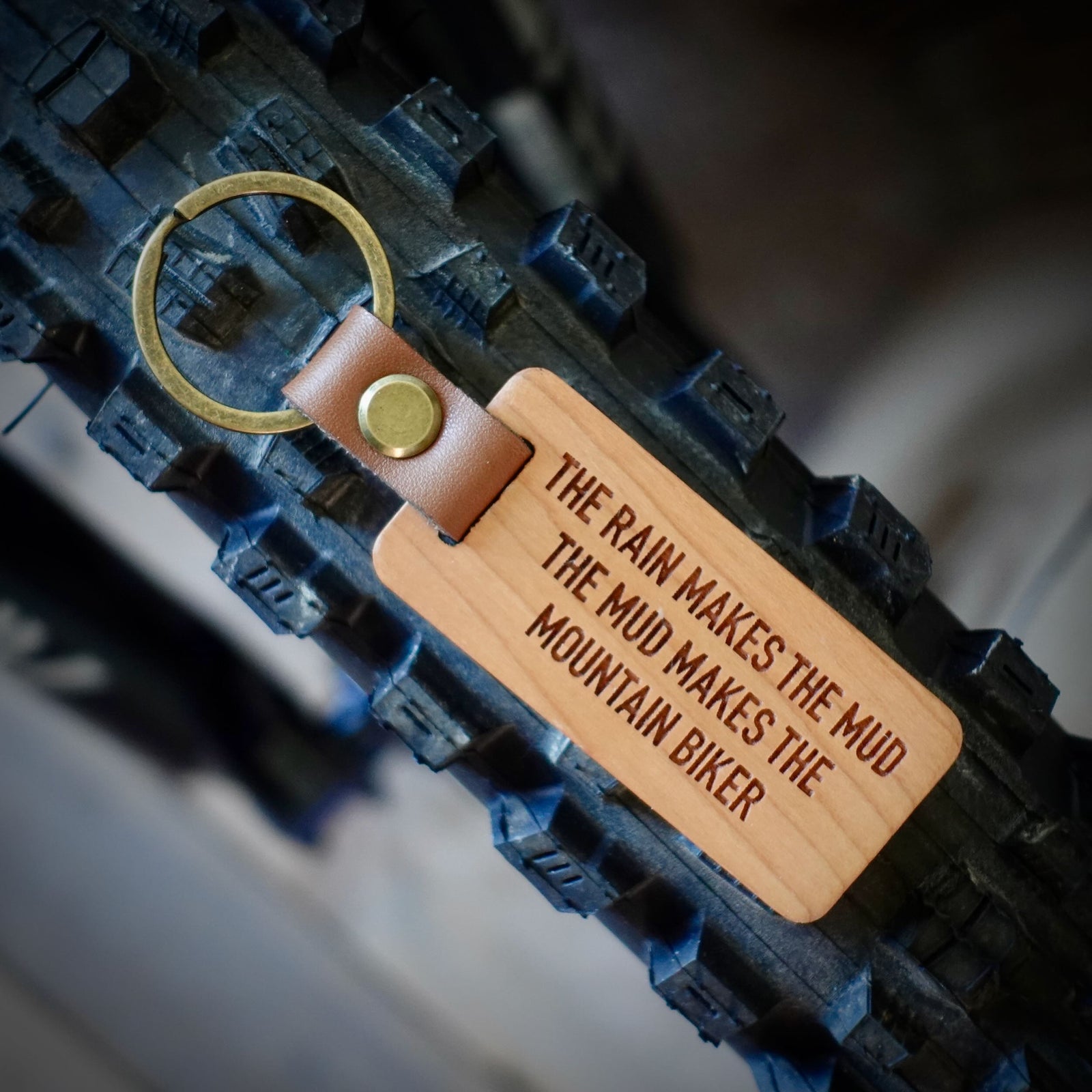 The Rain Makes The Mud Mountain Biker Key Ring