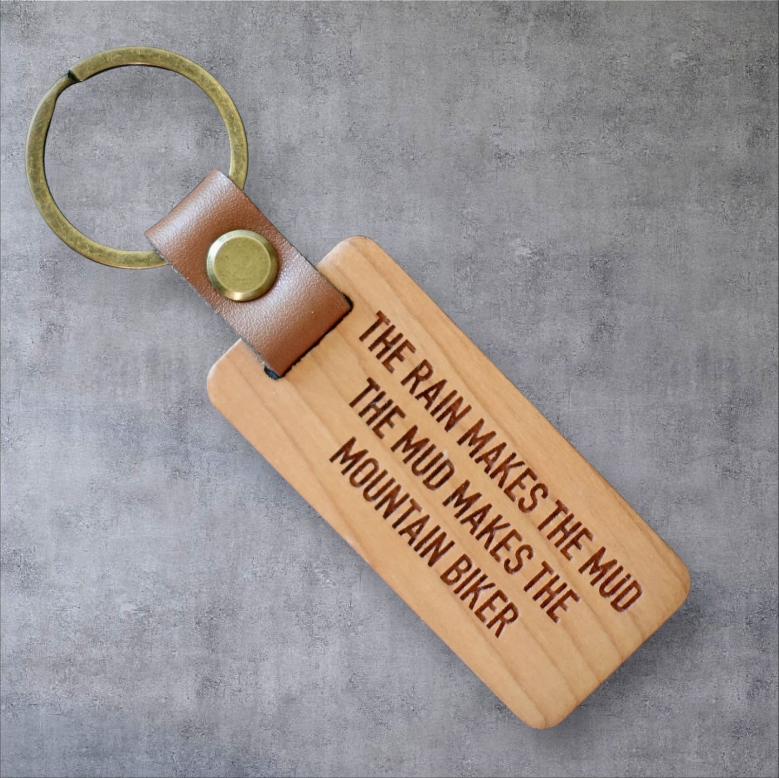 The Rain Makes The Mud Mountain Biker Key Ring